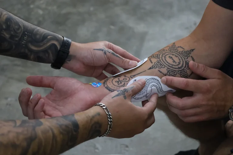 PUREink. artist preparing a tattoo stencil in Bangkok